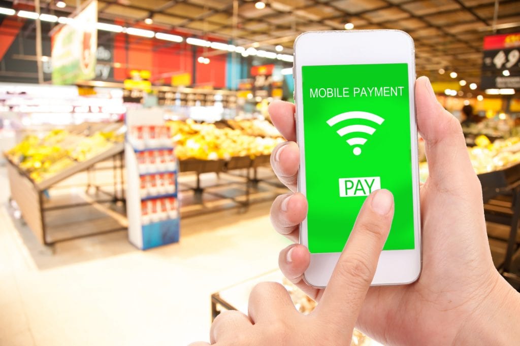 Mobile payment concept, Blur supermarket background, business and financial, technology.