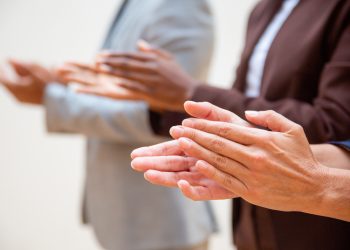 Hands of business people applauding speaker. Business group appreciating seminar, training or conference. Successful seminar concept