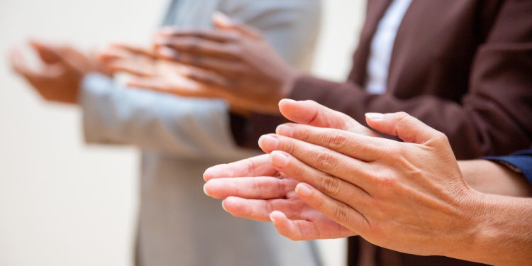 Hands of business people applauding speaker. Business group appreciating seminar, training or conference. Successful seminar concept